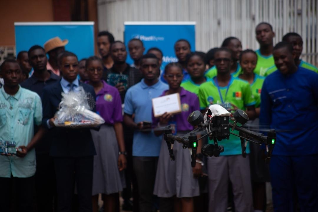 Maker using 3D printer at community event